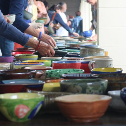 People selecting handcrafted bowls